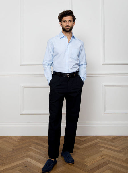 Man wearing sky blue long sleeved shirt made with 100% Royal Oxford Cotton.